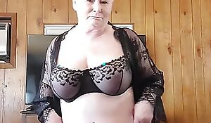 Horny Granny strips for you increased by shows her huge tits shaking.