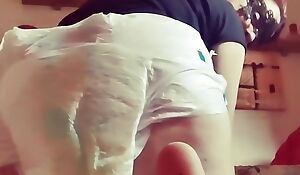 Dirty diaper hot onanism on top of a cushion
