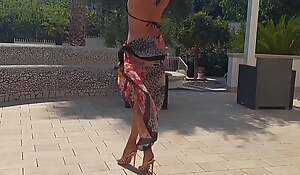Selena's outdoor dancing posing encircling high-heeled slippers