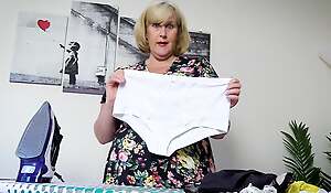 Nasty stepmom in stockings ironing her panties, takes a towards the rear together with fingers her raw beaver