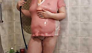 A chubby student girl takes a shower in the matter of a pink T-Shirt