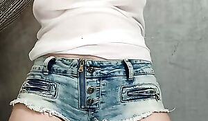 Bixanie cameltoe in denim cut-offs braless semitransparent blouse provocatively challenging croissant